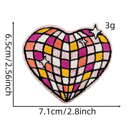 fruit and butterfly-shaped iron-on patches with a disco-ball pattern